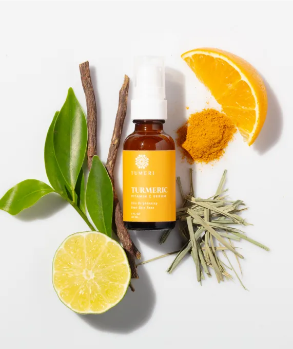 Tumeric product bottle with lemon and an orange